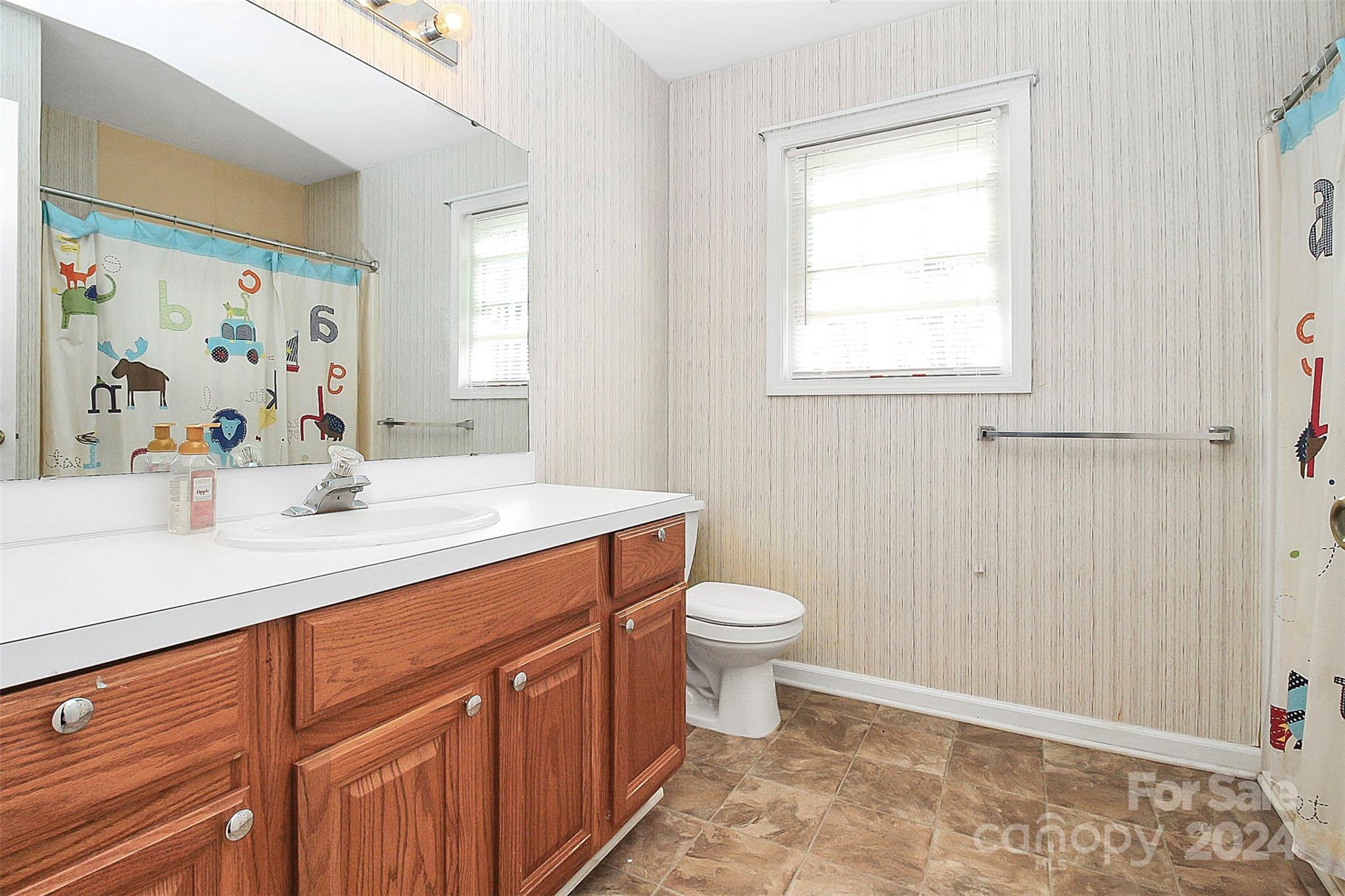 125 Vinson Road Rock Hill, SC 29730 - Photo 25 of 39 a bathroom with a sink a toilet and a window