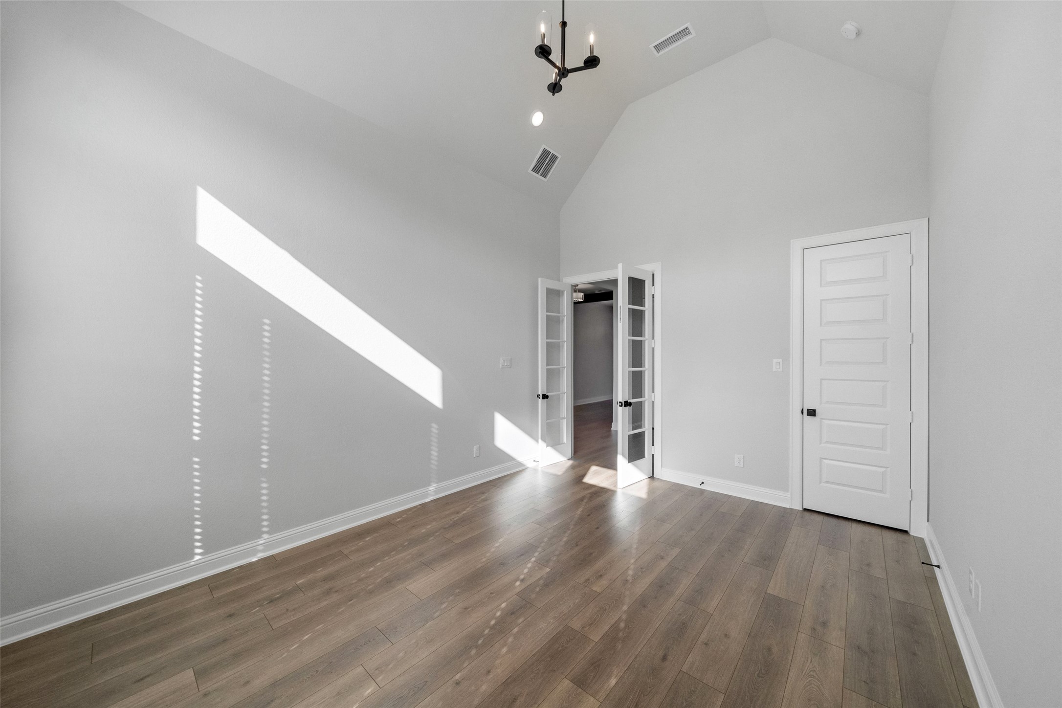 15464 Ringbill Way Magnolia, TX 77354 - Photo 20 of 37 a view of an empty room with wooden floor