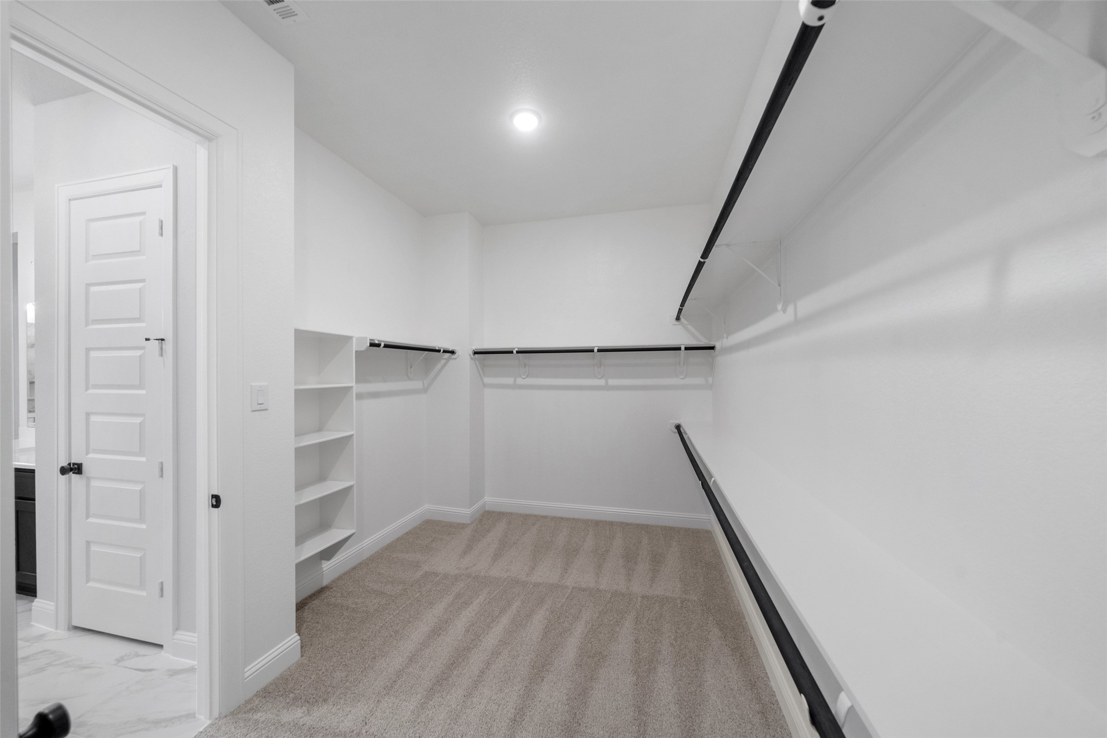 15464 Ringbill Way Magnolia, TX 77354 - Photo 26 of 37 a view of closet area with empty racks