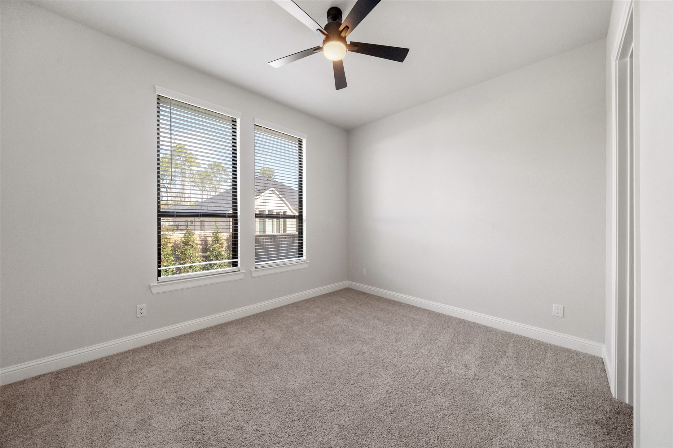 15464 Ringbill Way Magnolia, TX 77354 - Photo 29 of 37 an empty room with ceiling fan and windows