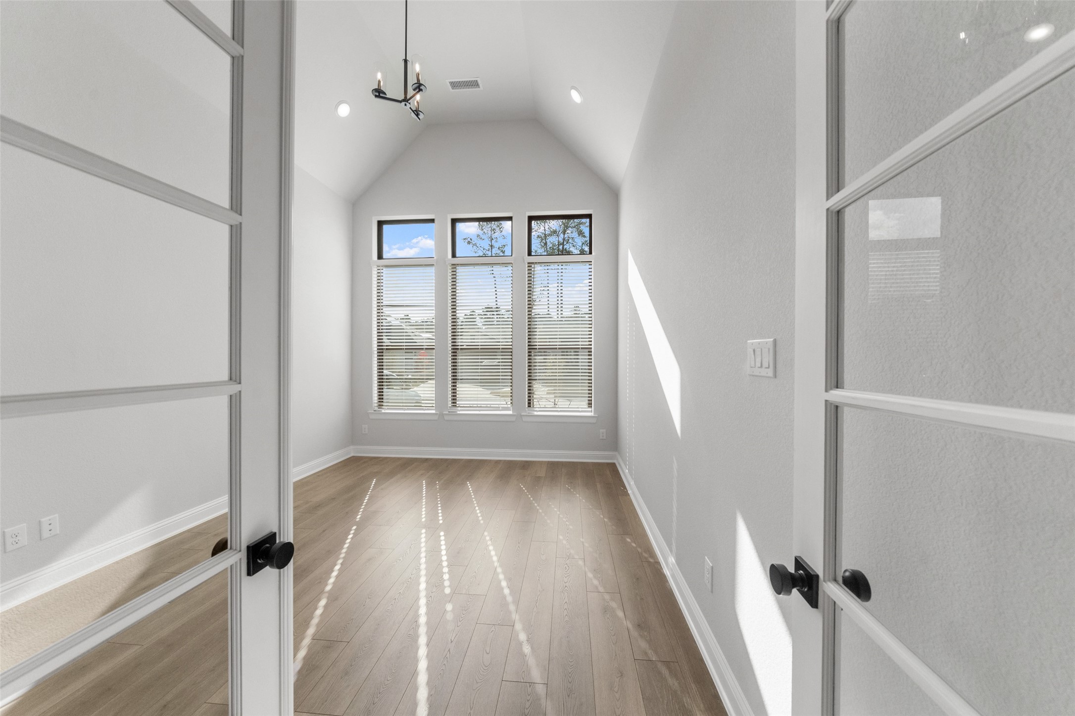15464 Ringbill Way Magnolia, TX 77354 - Photo 7 of 37 wooden floor in an empty room with a window