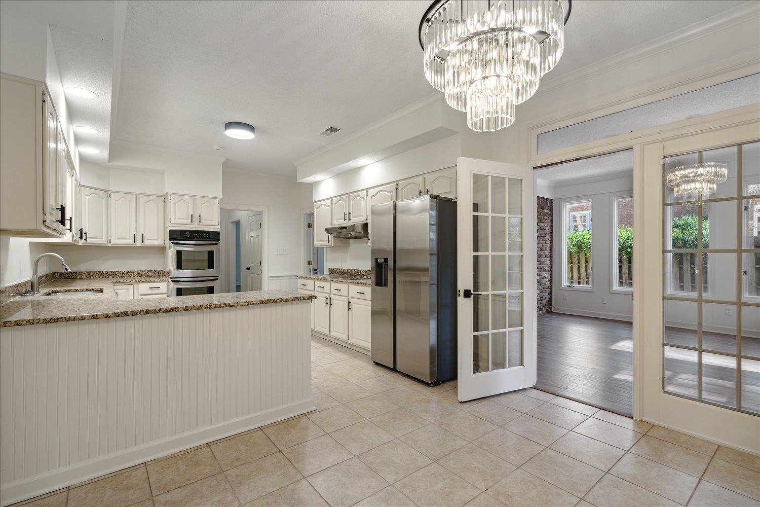 7215 Plantation Circle Germantown, TN 38138 - Photo 12 of 30 a kitchen with stainless steel appliances granite countertop a refrigerator and a sink