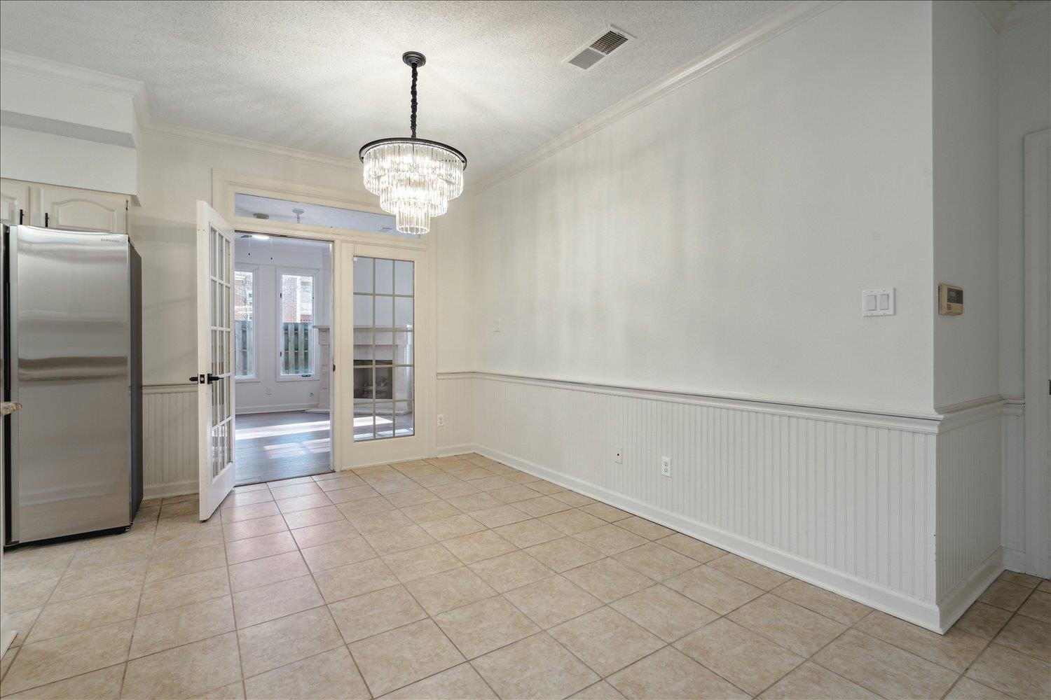 7215 Plantation Circle Germantown, TN 38138 - Photo 15 of 30 a view of a refrigerator in kitchen and white cabinets