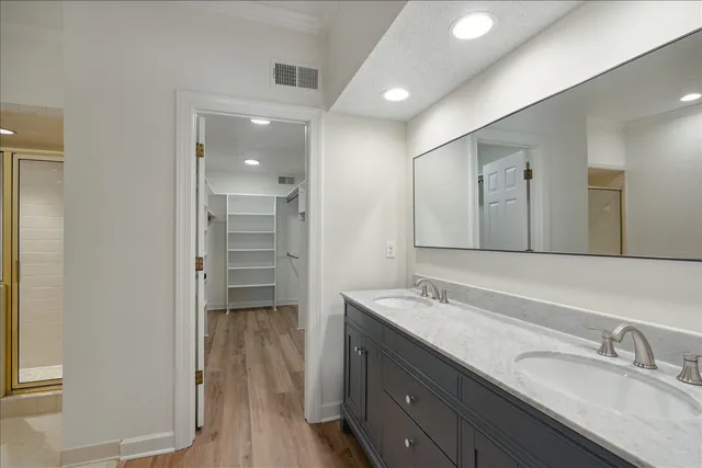 a bathroom with a granite countertop sink mirror and double