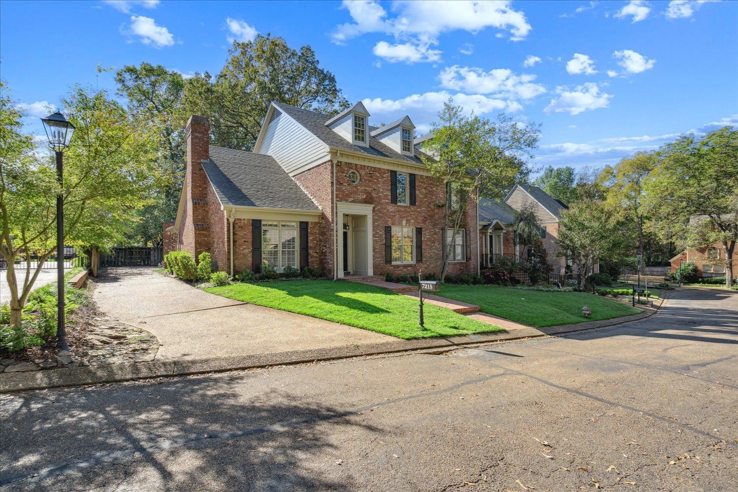 7215 Plantation Circle Germantown, TN 38138 - Photo 2 of 30 a house that has a tree in front of it