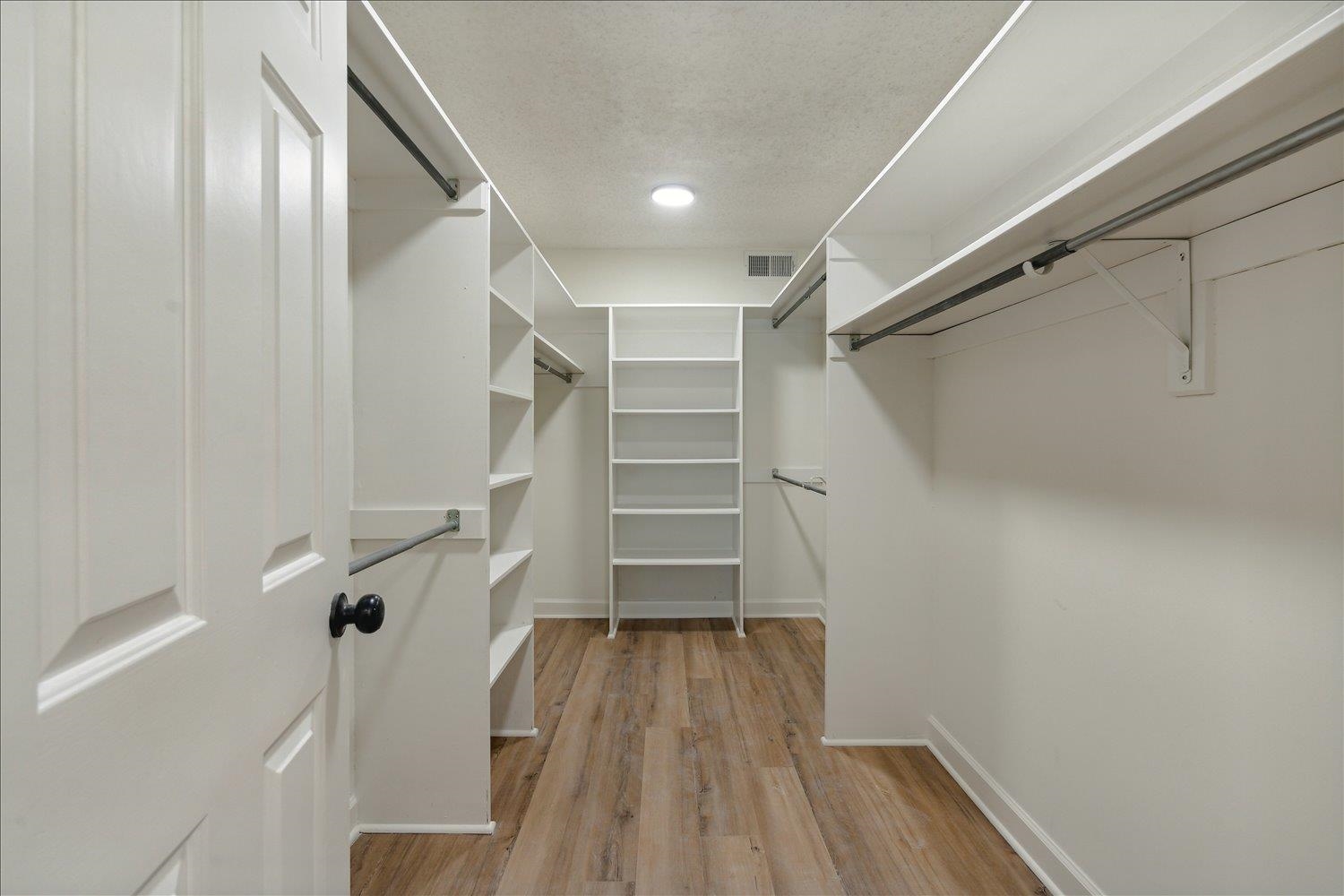 7215 Plantation Circle Germantown, TN 38138 - Photo 21 of 30 a view of walk in closet with empty racks