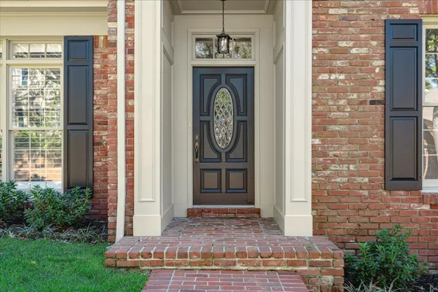 a front view of a house with garden