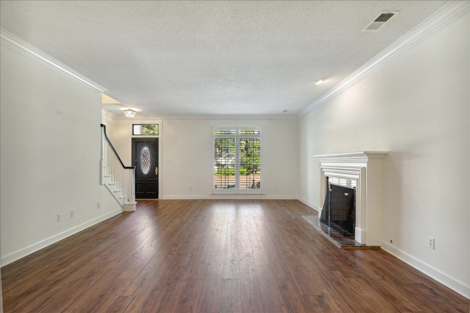 7215 Plantation Circle Germantown, TN 38138 - Photo 7 of 30 wooden floor in an empty room with a window