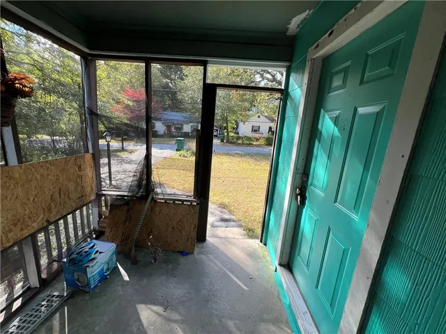 a view of a porch with furniture