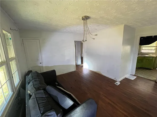 a view of workspace with wooden floor windows