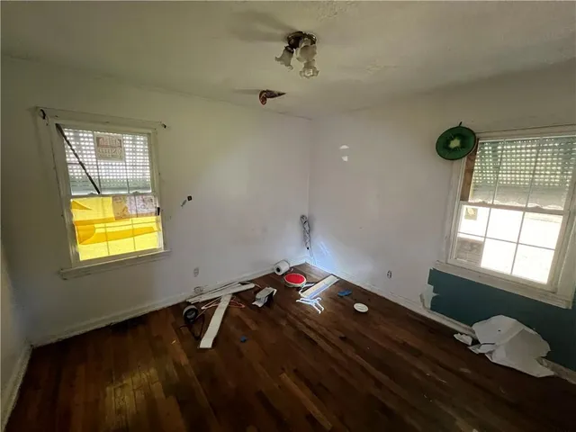 a room with gym equipment and a window