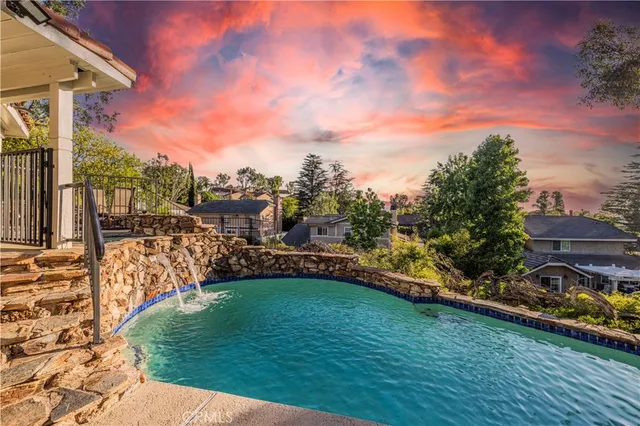 a view of a lake with a house in the background