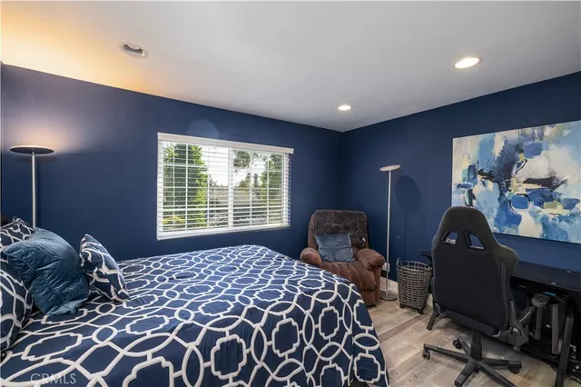a view of a hallway and closet and wooden floor