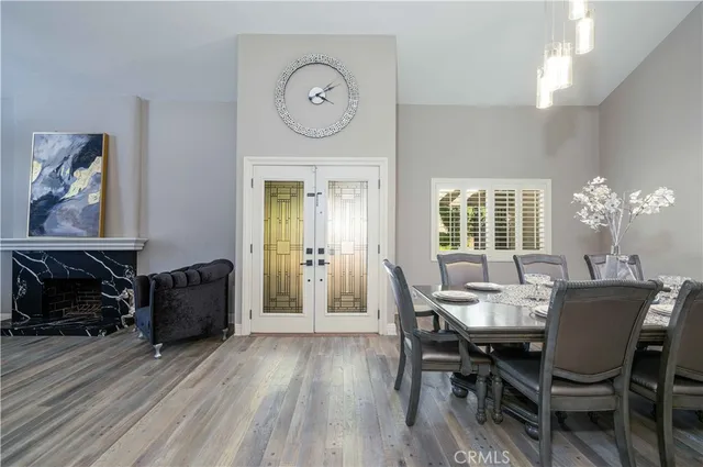 a view of a dining room with furniture and chandelier
