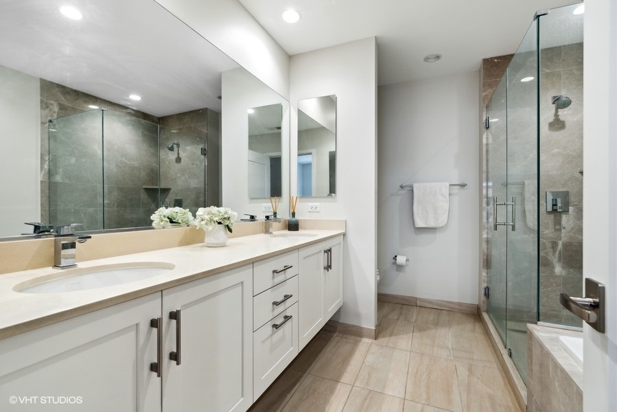 1648 South Prairie Avenue, Unit 2 Chicago, IL 60616 - Photo 12 of 19 a spacious bathroom with a double vanity sink mirror and double