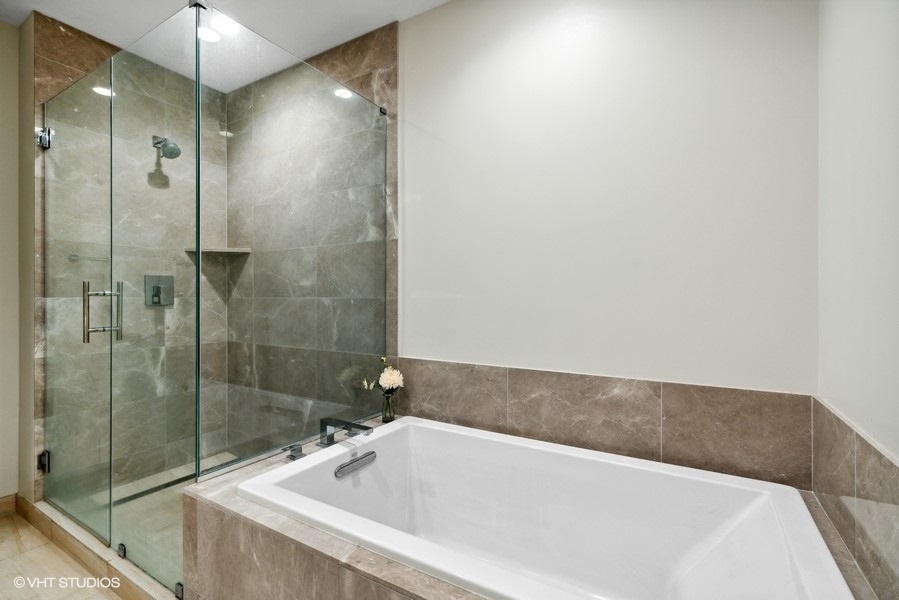 1648 South Prairie Avenue, Unit 2 Chicago, IL 60616 - Photo 13 of 19 a bathroom with a bathtub and a shower