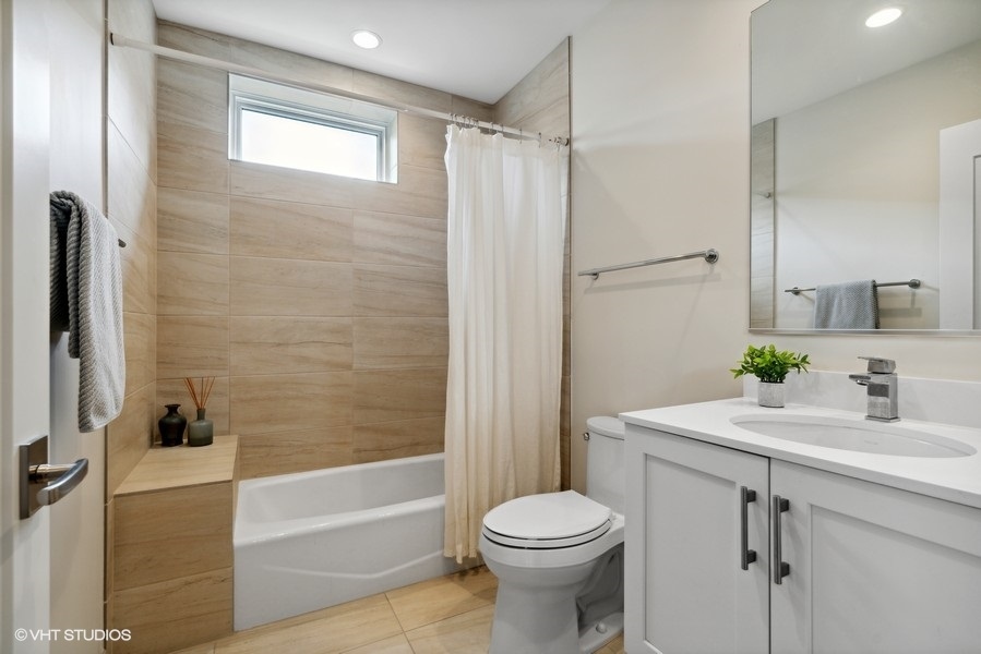 1648 South Prairie Avenue, Unit 2 Chicago, IL 60616 - Photo 15 of 19 a bathroom with a sink a toilet and shower