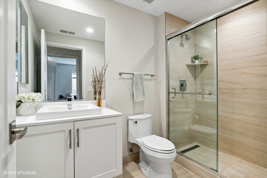 1648 South Prairie Avenue, Unit 2 Chicago, IL 60616 - Photo 17 of 19 a bathroom with a sink toilet and shower