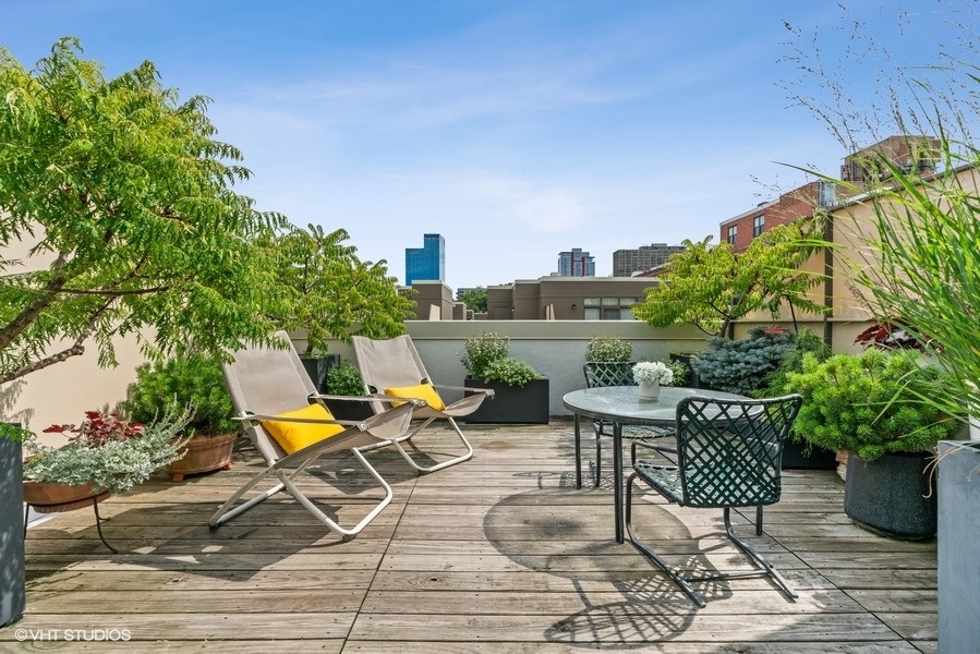 1648 South Prairie Avenue, Unit 2 Chicago, IL 60616 - Photo 3 of 19 a view of a swimming pool with chair and table