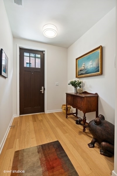 1648 South Prairie Avenue, Unit 2 Chicago, IL 60616 - Photo 4 of 19 a bedroom with a bed and furniture