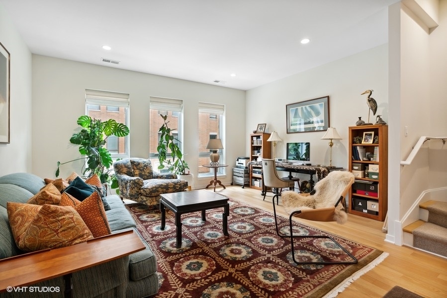 1648 South Prairie Avenue, Unit 2 Chicago, IL 60616 - Photo 8 of 19 a living room with furniture and a rug
