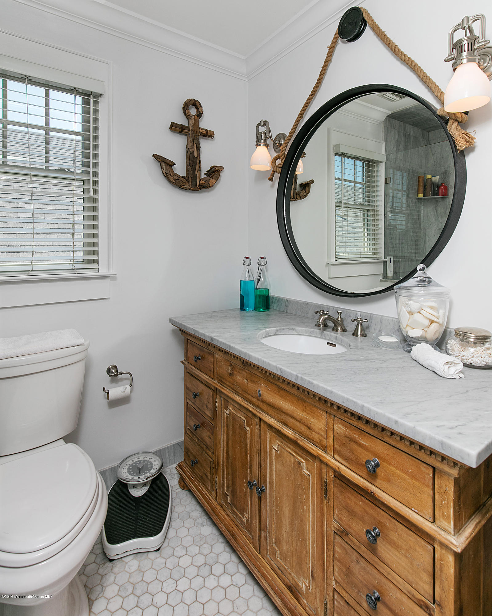 6 Via Ripa Sea Bright, NJ 07760 - Photo 15 of 25 a bathroom with a toilet a sink and mirror