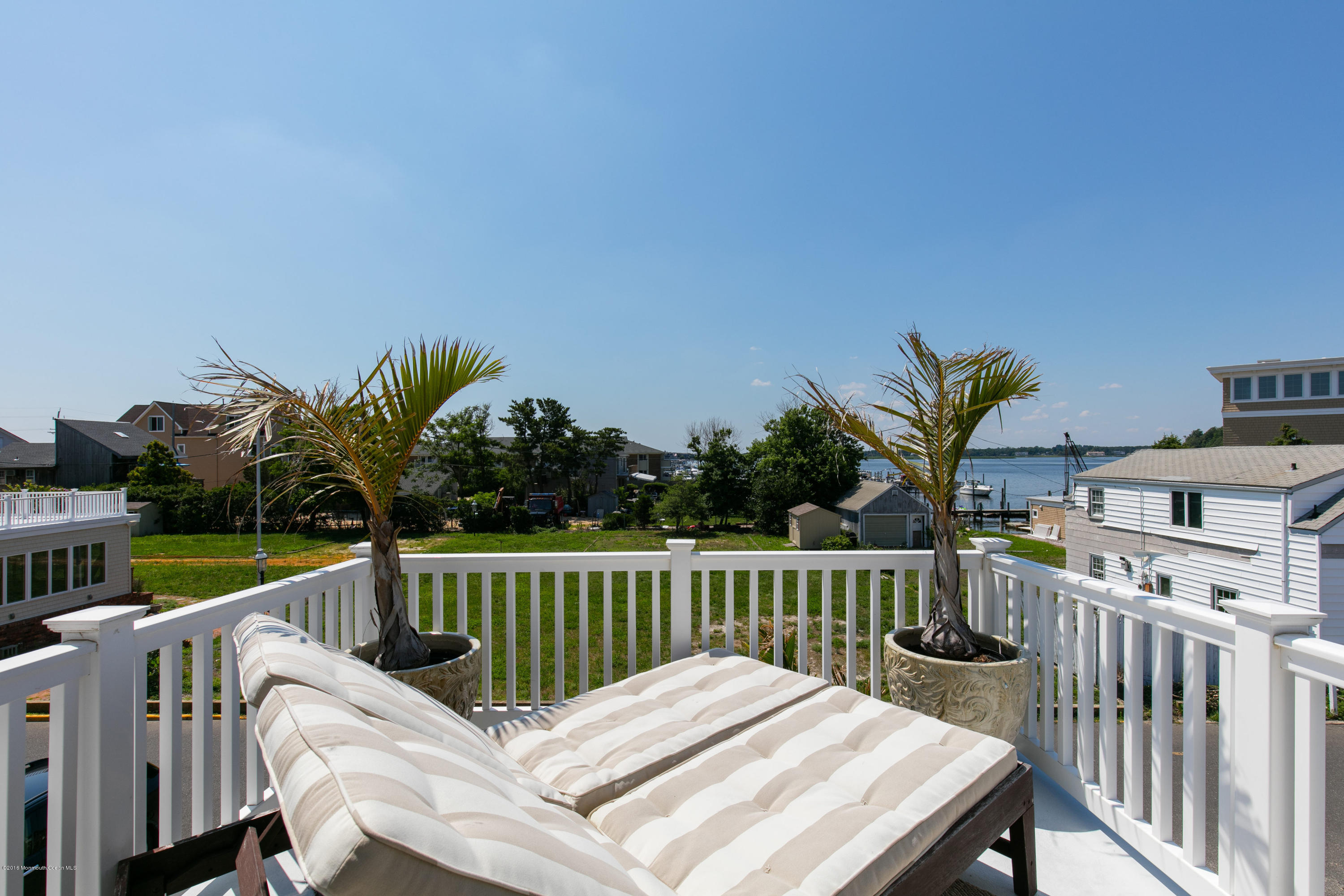 6 Via Ripa Sea Bright, NJ 07760 - Photo 16 of 25 a view of a chair and table on the deck