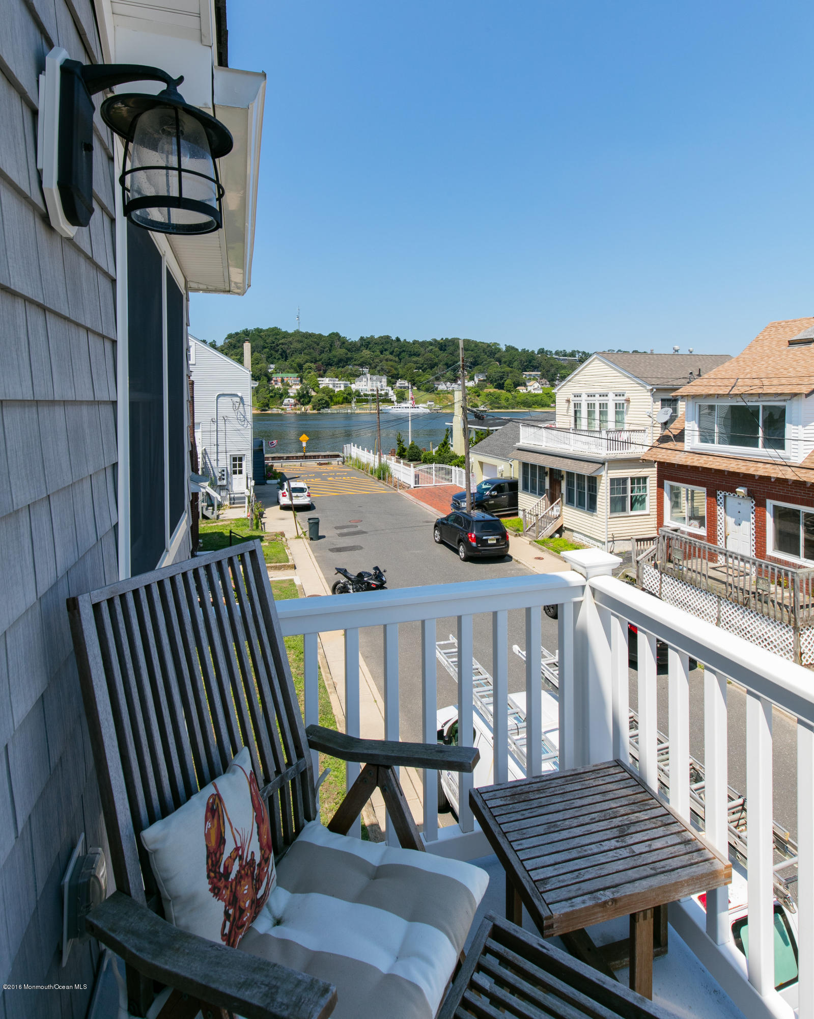 6 Via Ripa Sea Bright, NJ 07760 - Photo 19 of 25 a view of a balcony with wooden floor and outdoor seating