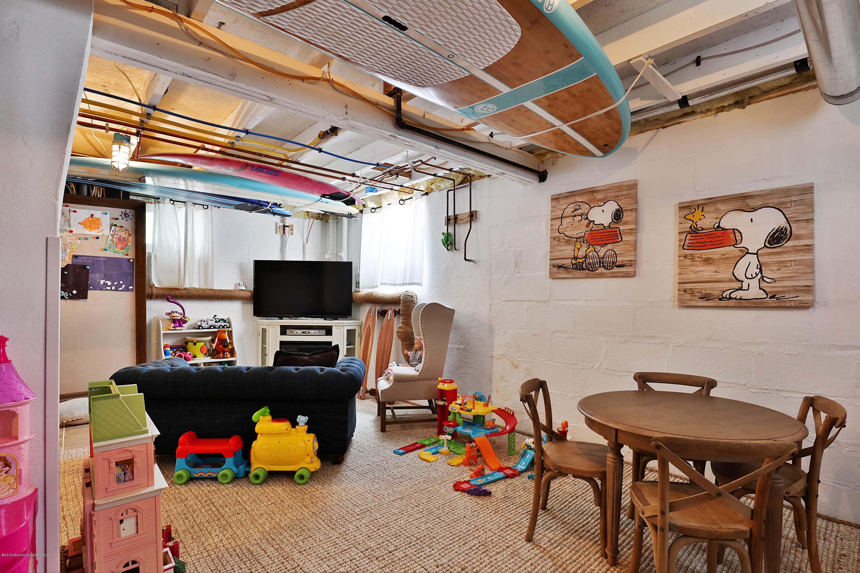 6 Via Ripa Sea Bright, NJ 07760 - Photo 25 of 25 a room with furniture and a flat screen tv