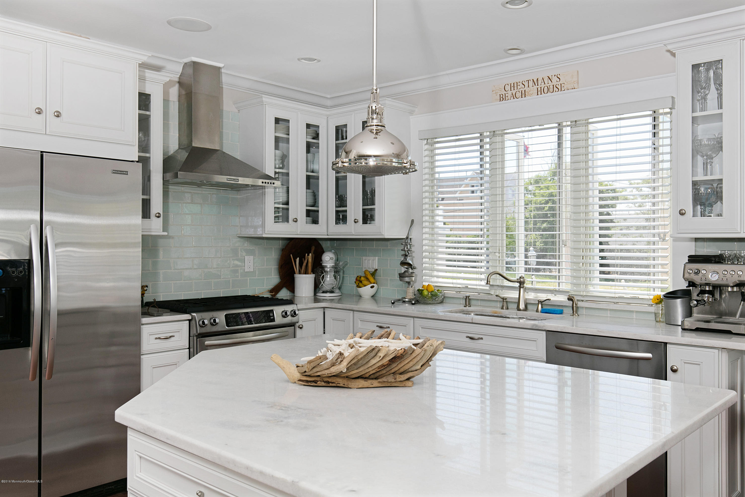 6 Via Ripa Sea Bright, NJ 07760 - Photo 5 of 25 a kitchen with stainless steel appliances a sink a stove and a refrigerator