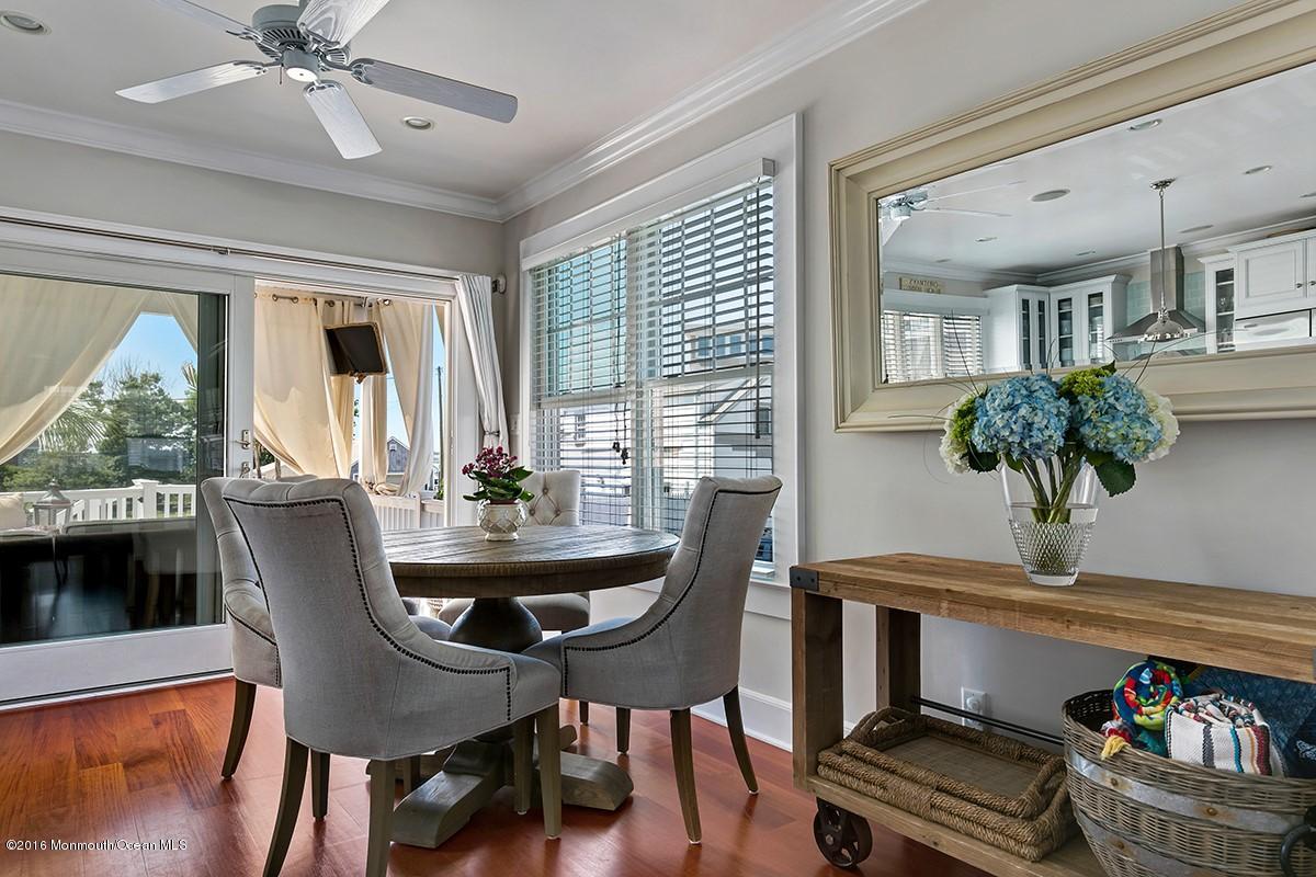 6 Via Ripa Sea Bright, NJ 07760 - Photo 7 of 25 a dining room with furniture potted plants and wooden floor