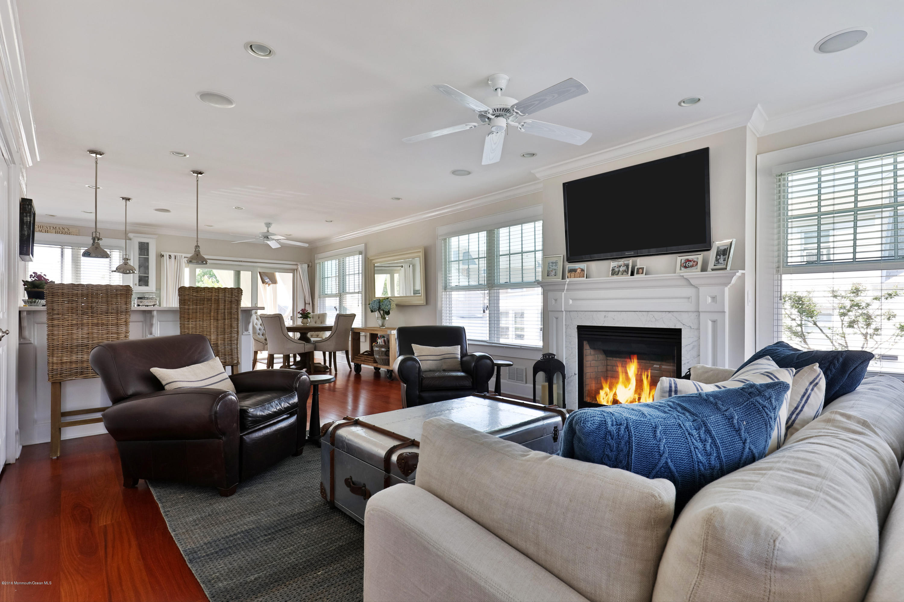 6 Via Ripa Sea Bright, NJ 07760 - Photo 8 of 25 a living room with furniture fireplace and flat screen tv