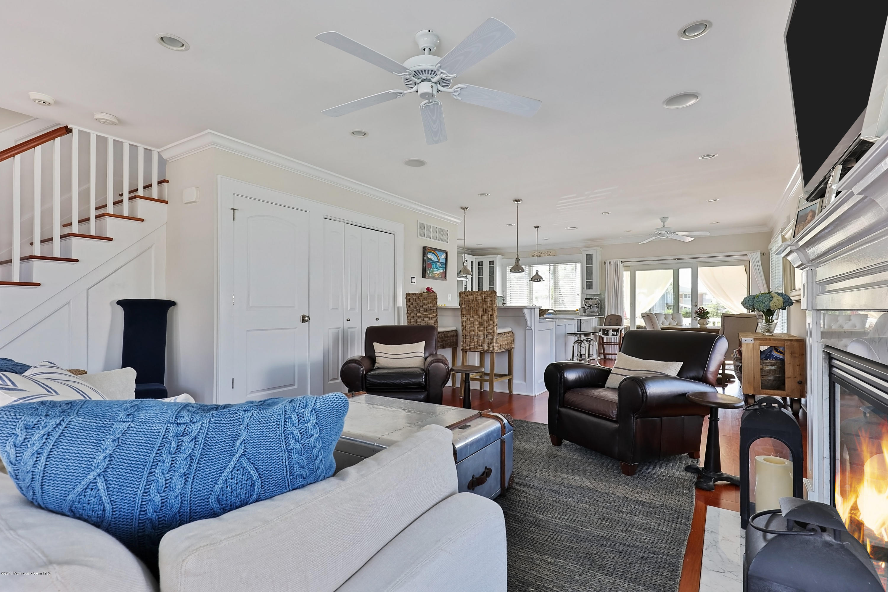 6 Via Ripa Sea Bright, NJ 07760 - Photo 10 of 25 a living room with furniture ceiling fan and a flat screen tv