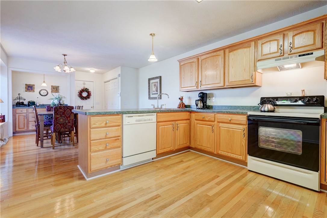 65 Cloverdale Street Rochester, NY 14612 - Photo 10 of 50 Spacious Eat-in Kitchen with gleaming hardwood flo