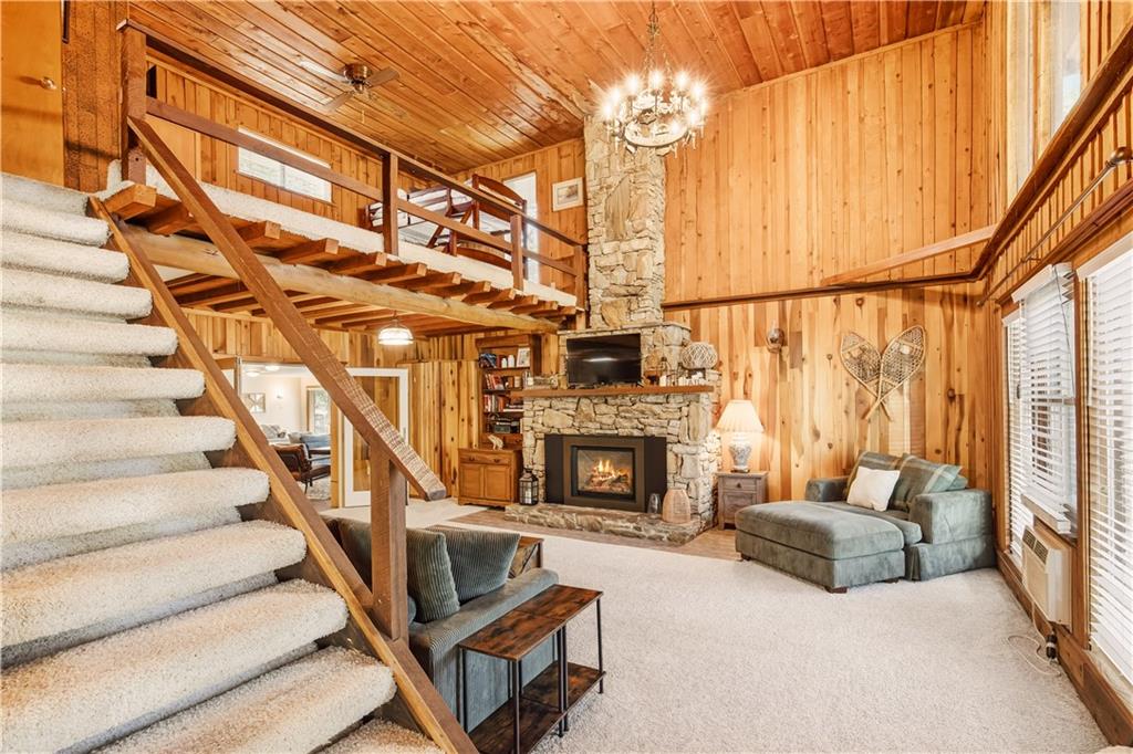 186 Lake Rd Lane Rockwood, PA 15557 - Photo 11 of 50 a living room with furniture a fireplace and a chandelier