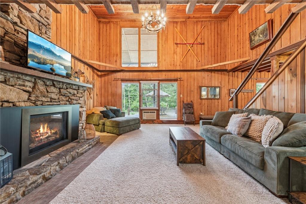 186 Lake Rd Lane Rockwood, PA 15557 - Photo 14 of 50 a living room with furniture a fireplace and a flat screen tv
