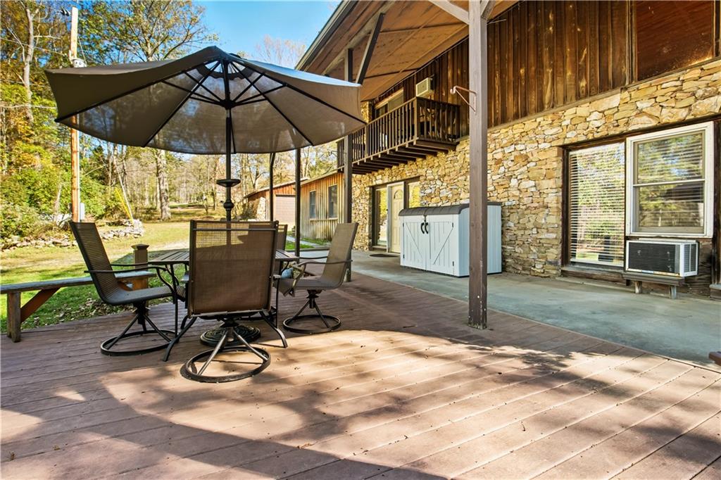 186 Lake Rd Lane Rockwood, PA 15557 - Photo 6 of 50 a view of a backyard with table and chairs under an umbrella