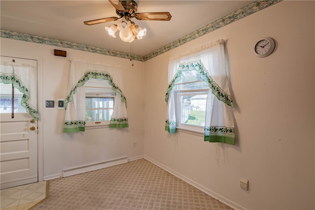 2287 West Cushing Street Decatur, IL 62526 - Photo 4 of 23 wooden floor in an empty room with a window