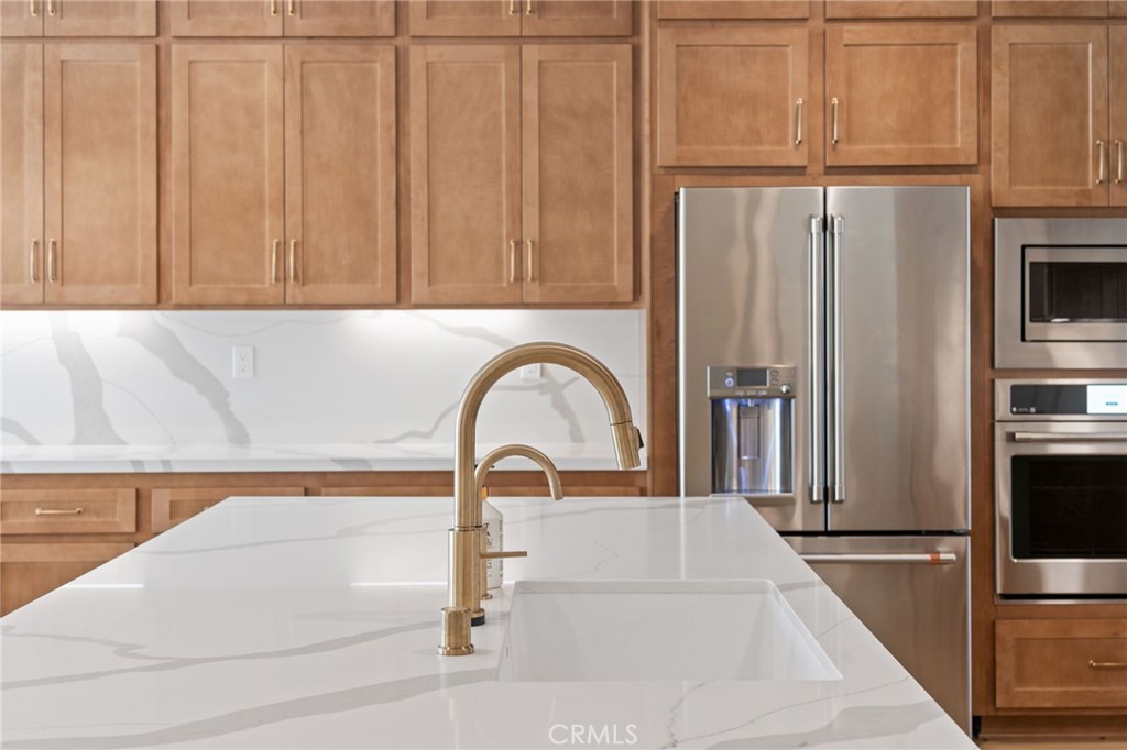 39565 Caladium Drive Temecula, CA 92591 - Photo 14 of 66 a close view of a sink and a refrigerator