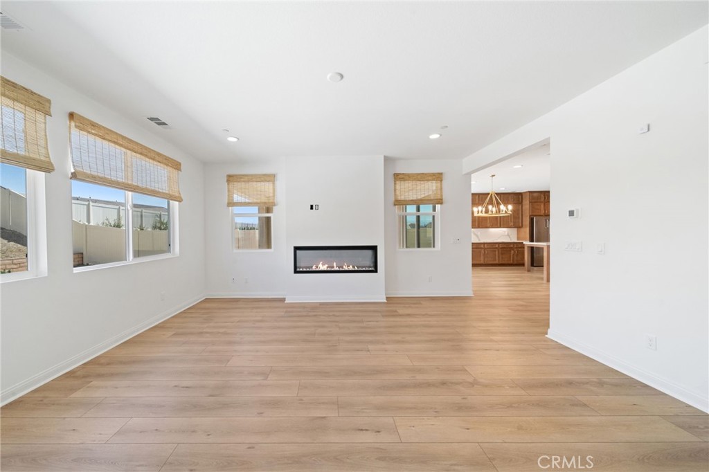 39565 Caladium Drive Temecula, CA 92591 - Photo 21 of 66 Family room both 50" Electric Fireplace.