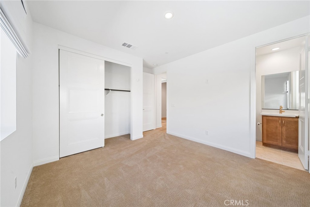 39565 Caladium Drive Temecula, CA 92591 - Photo 25 of 66 a view of an empty room with a kitchen