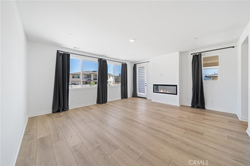 39565 Caladium Drive Temecula, CA 92591 - Photo 43 of 66 a view of a livingroom with a closet and a refrigerator