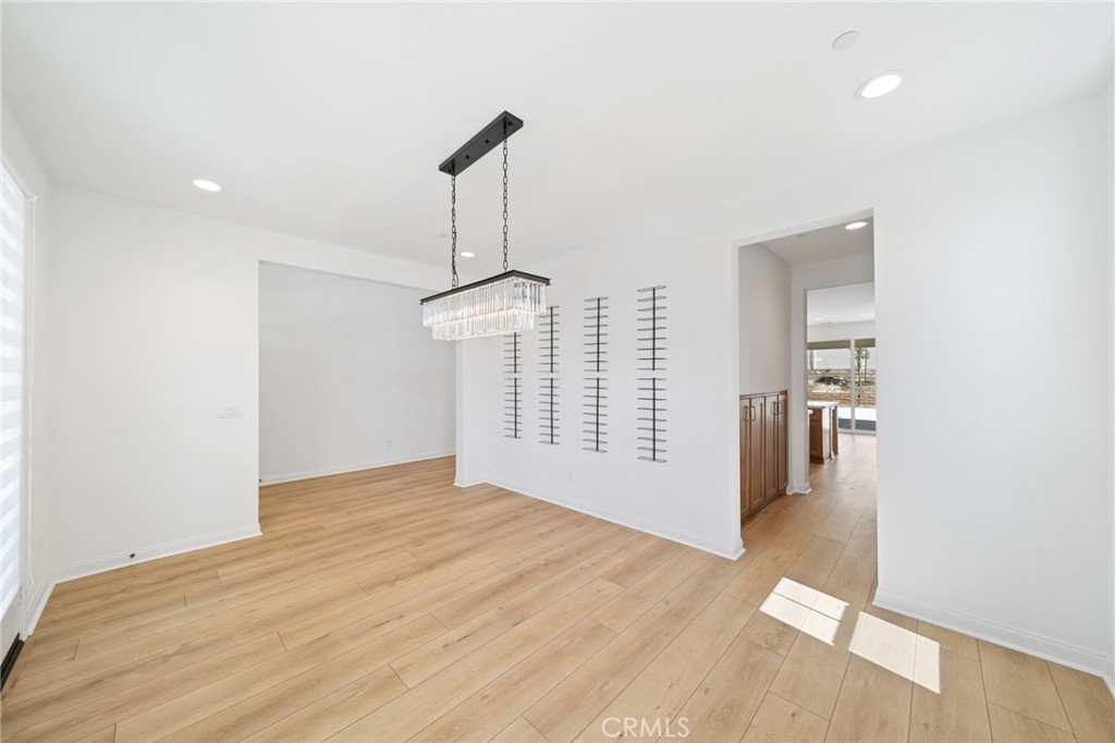 39565 Caladium Drive Temecula, CA 92591 - Photo 9 of 66 Dining room with passthrough to kitchen through the butlers pantry.