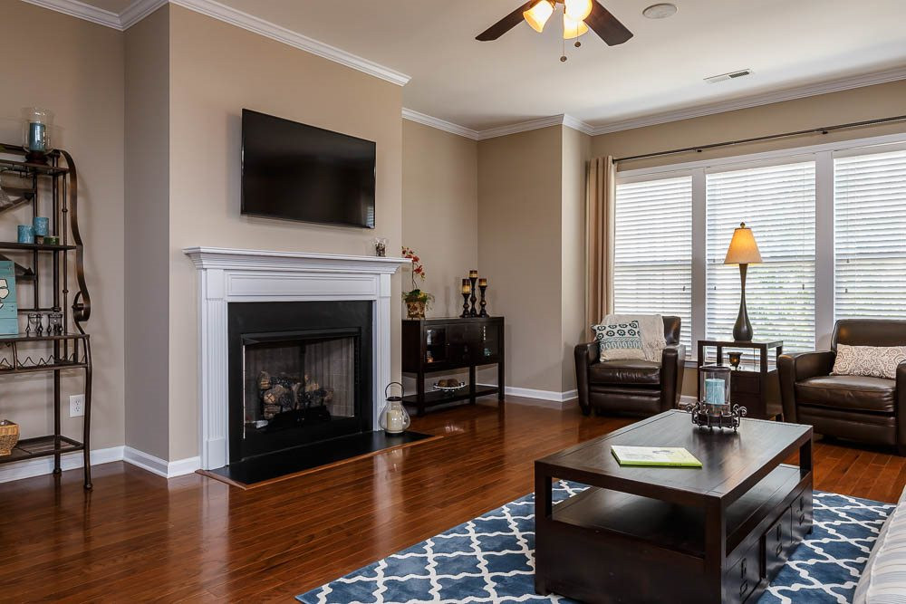 9154 Wooden Road Raleigh, NC 27617 - Photo 2 of 25 Enjoy the gas log fireplace in family room by a flick of the switch! Wired to mount your television above the fireplace (and to the side) so everyone has a great seat to watch the game!