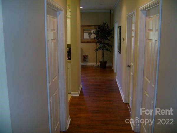 18125 West Catawba Avenue, Unit 1 Cornelius, NC 28031 - Photo 6 of 10 a view of a hallway with a wooden floor