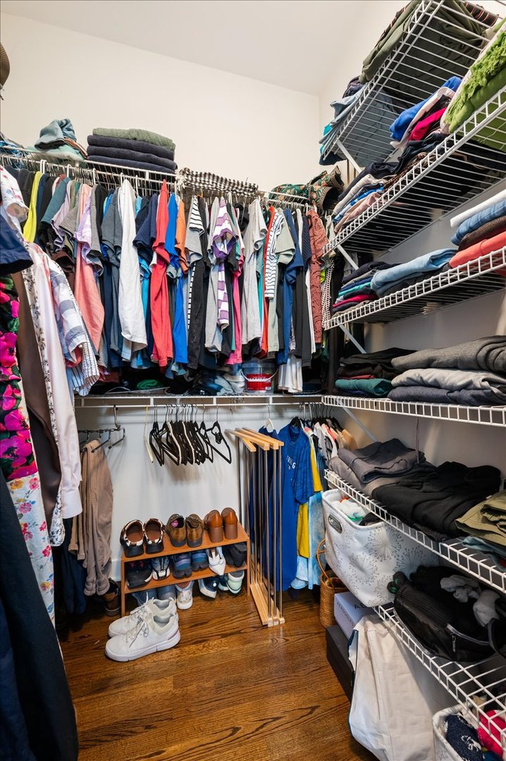 428 North Noble Street, Unit 2 Chicago, IL 60642 - Photo 18 of 20 a view of walk in closet with clothes and shoes