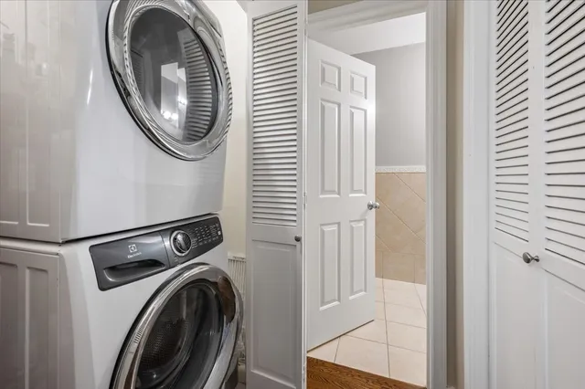 a view of a hallway with washer and dryer
