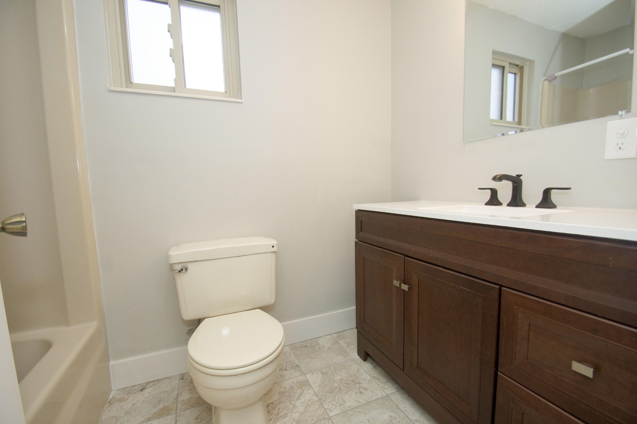 102 Goucher Circle Oak Ridge, TN 37830 - Photo 13 of 37 a bathroom with a granite countertop toilet a sink and a mirror