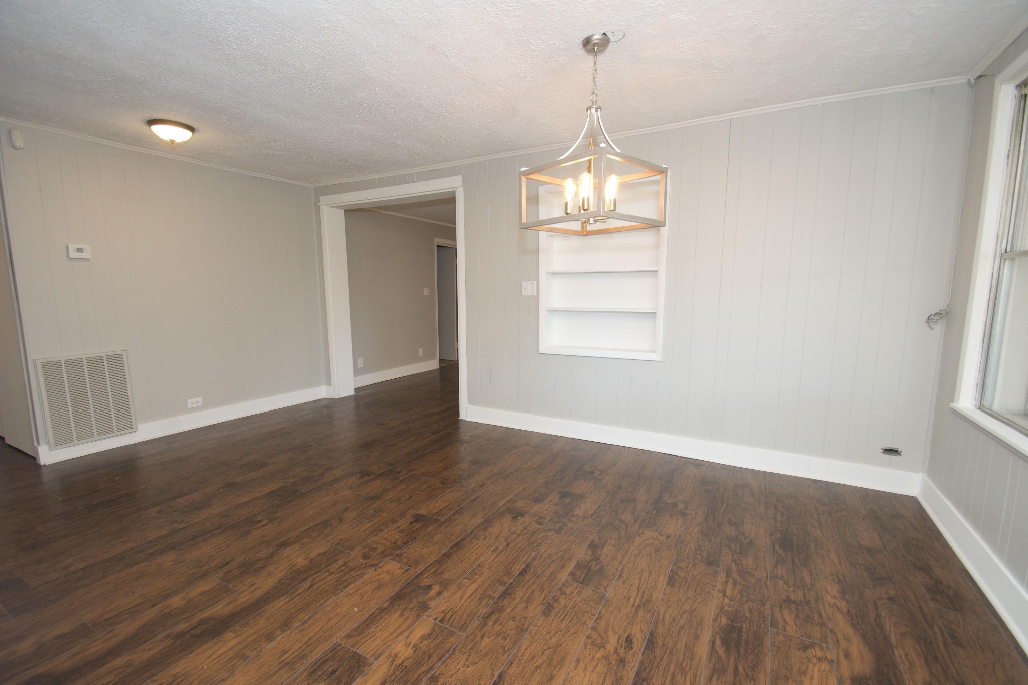 102 Goucher Circle Oak Ridge, TN 37830 - Photo 18 of 37 an empty room with wooden floor and window