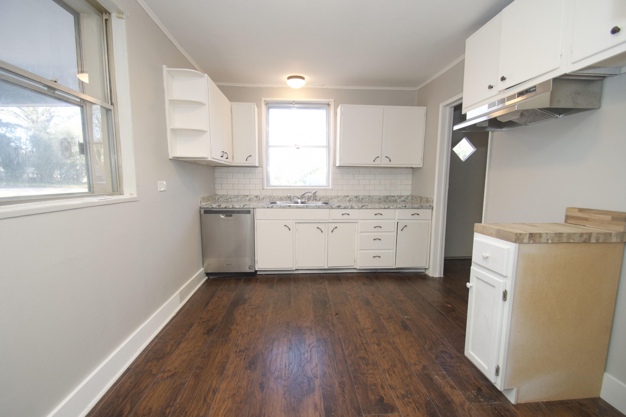 102 Goucher Circle Oak Ridge, TN 37830 - Photo 20 of 37 a kitchen with a white cabinets and wooden floor